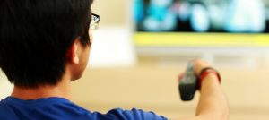 Person Watching Television Ads